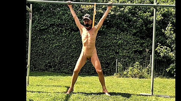 naked pathetic slave during outdoor party tied up at his testicles entertain the guests,CMNM