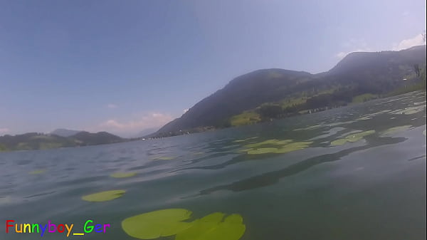 Underwater fun: Gay guy jerks off his foreskin penis in a lake in the mountains. (S)